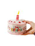 Plush Happy Birthday cake dog toy with red and white candle from The Barkery Las Vegas.