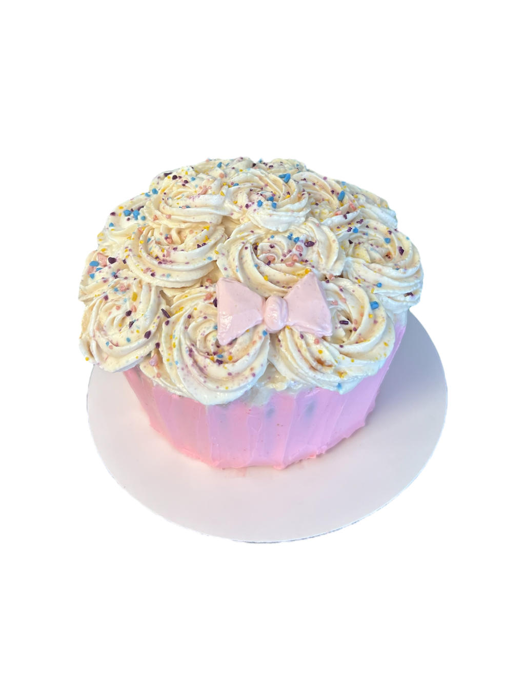 Custom giant cupcake dog cake with swirled frosting, pastel sprinkles, and pink bow from The Barkery Las Vegas handmade pet birthday cake.