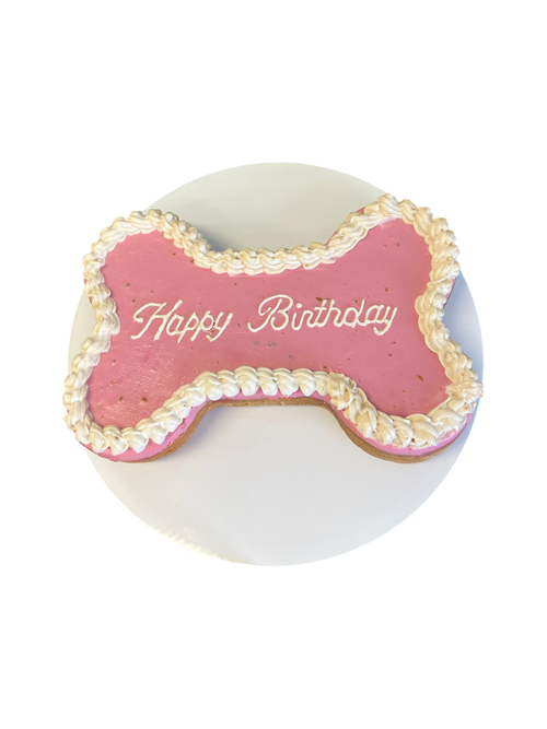 Bone Dog Cake with pink icing and Happy Birthday written on top, perfect for dog celebrations
