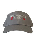 Gray cap with embroidered text reading easily distracted by dogs and paw print accents