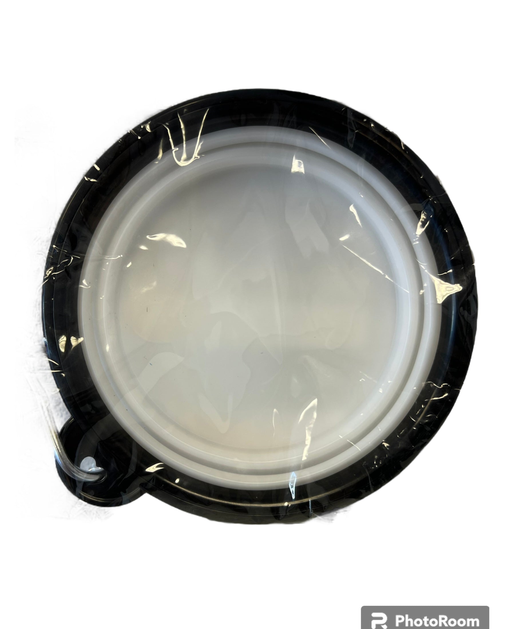 Foldable dog water bowl in black and white design, perfect for traveling with pets