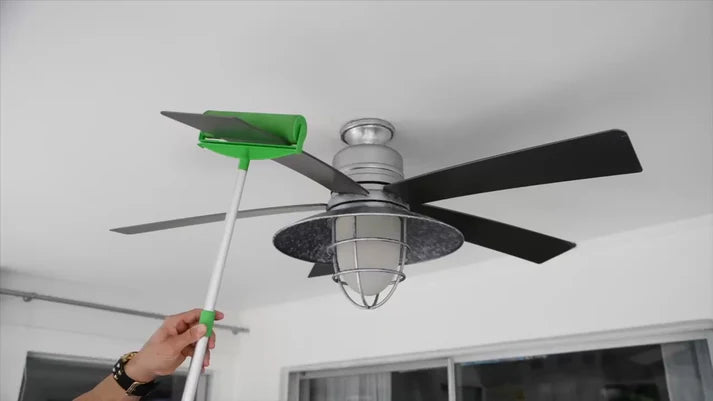 Large sticky roller for easy dust removal on ceiling fans with extendable handle