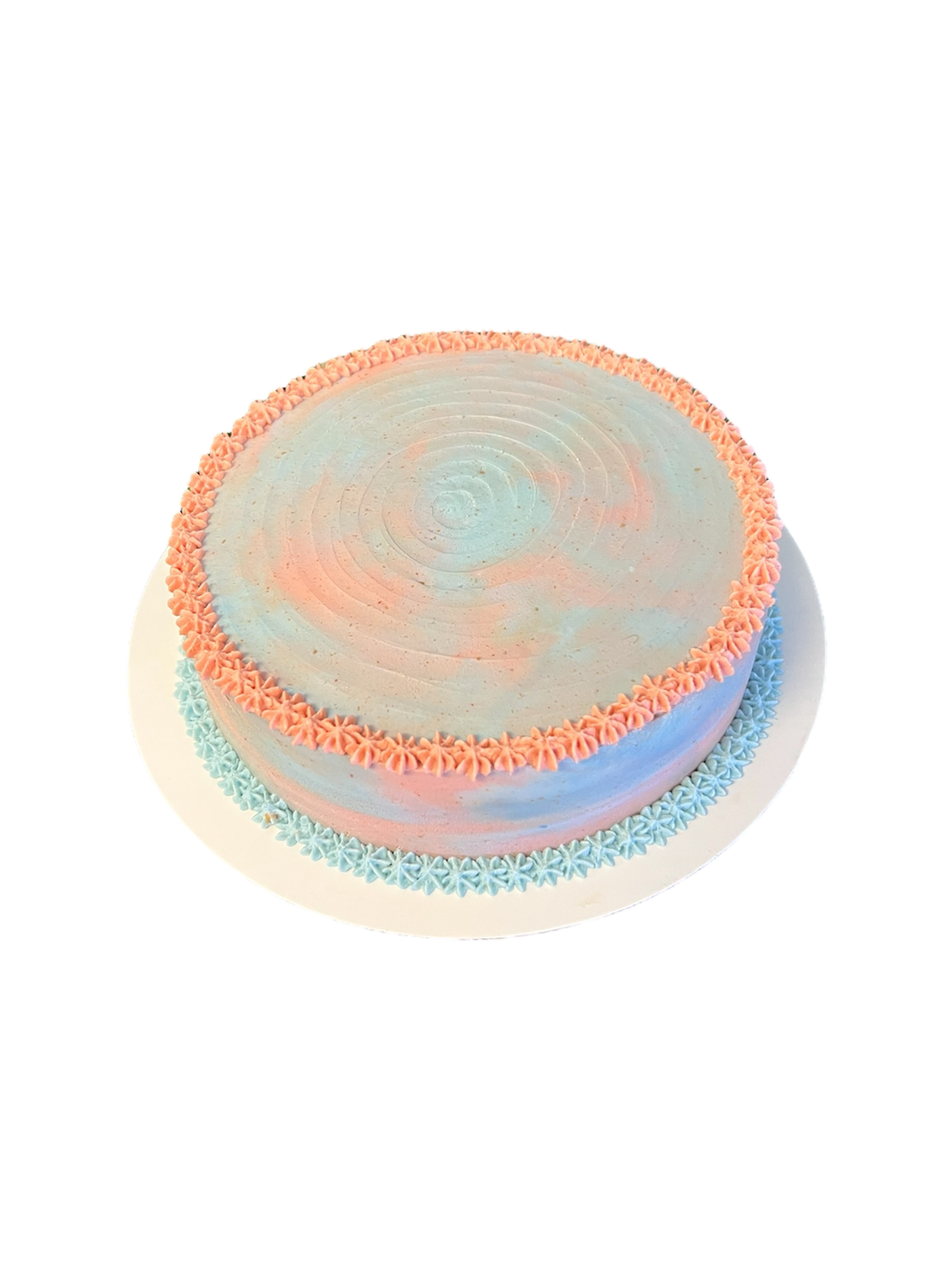 The Barkery LLC pastel pink and blue frosting gender reveal dog cake with decorative piped edges