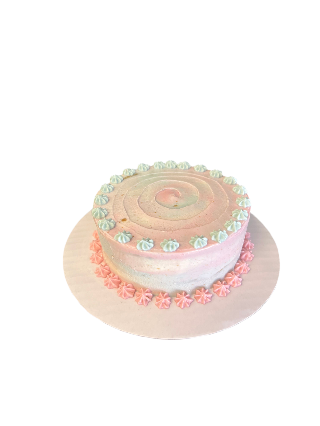 The Barkery LLC gender reveal dog cake with pink and blue frosting swirls and decorative icing accents