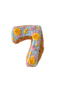 Organic dog birthday cake shaped like number seven with colorful frosting and decorative flowers