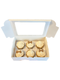 Box of six organic dog cupcakes topped with creamy frosting and bone-shaped treats